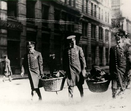 New York City officers remove the belongings of the dead from the scene of the Triangle Factory Fire